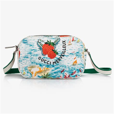 gucci strawberry cosmetic bag|Gucci bag with butterfly buckle.